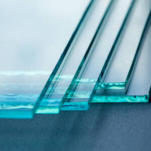 Sheets of Factory manufacturing tempered clear float glass panels cut to size.