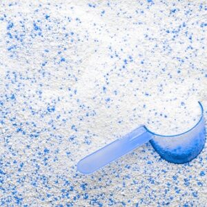 Detergent powder. White wash soap texture with cup for laundry background. Liquid soap in scoop for machine. Housekeeping and household, domestic housework cleaning service concept